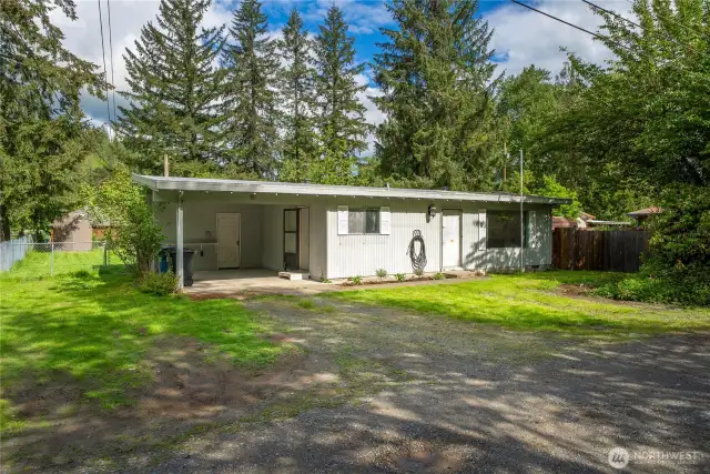 Mature evergreens provide a peaceful, private backdrop. A perfect first impression for this income-producing gem!
