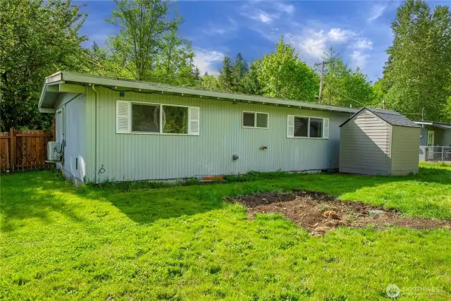 Expansive backyard with plenty of room for gardening, play, or future projects—fully fenced and ready for your vision.