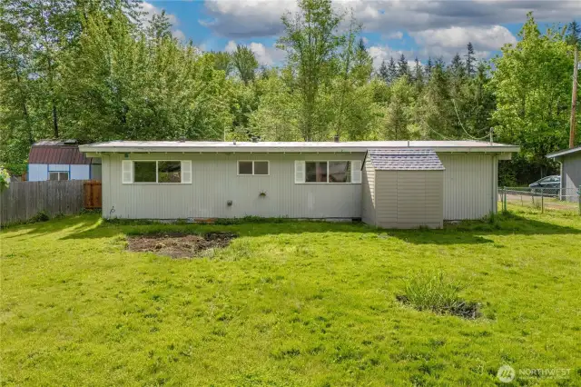 Spacious backyard with mature trees, ideal for pets, gardening, or entertaining. Plenty of room to make it your own oasis.