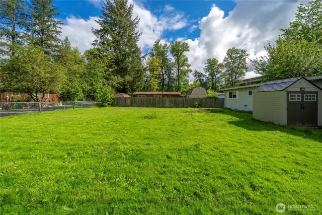 Wide, open yard—perfect for pets, hosting summer BBQs, or simply soaking up the Northwest sunshine.