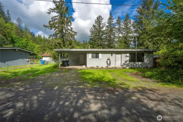 Covered parking and plenty of off-street space make everyday living convenient. Bonus storage area and workspace included!