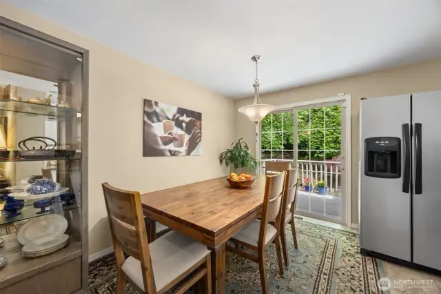 The dining area opens to the deck, perfect for outside enjoyment and entertaining.