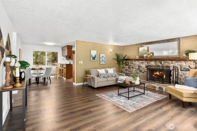 Enter the large living room with massive stone fireplace