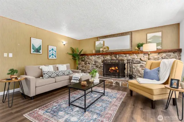 Hand-carved mantle graces the cozy fireplace