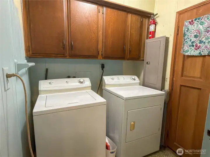 Washer and Dryer stay; door leads out to the back yard.