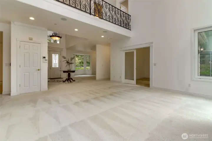 Open concept living looking toward entry