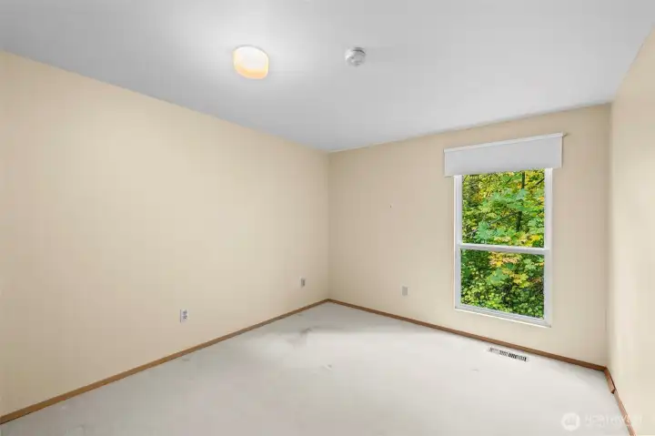 Additional bedroom #1 with nature just outside the window.