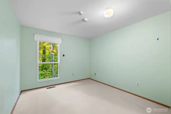 Additional bedroom #2 with large window and gorgeous view of greenbelt.
