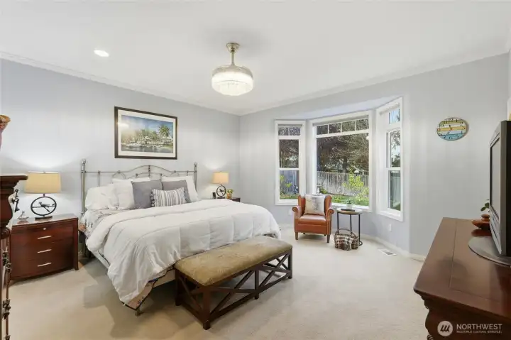 Luxurious primary suite with fully remodeled ensuite.