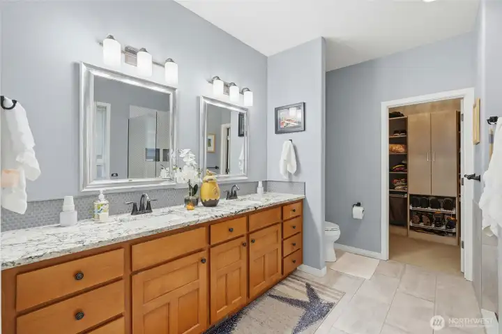 Remodeled primary ensuite with dual sinks and tons of counter space.