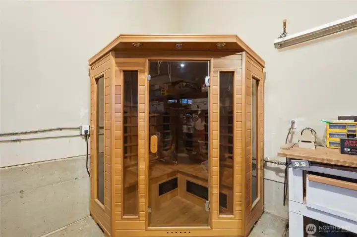 Sizable 3-car garage with relaxing sauna and abundant storage.