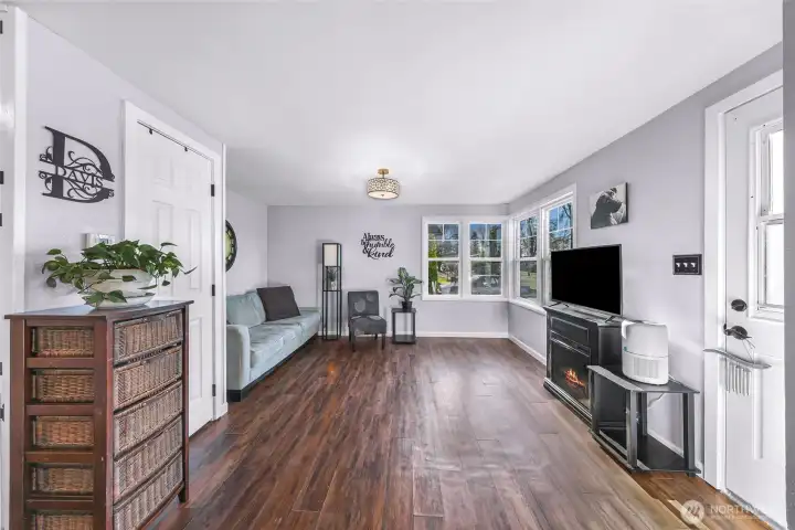view of living room from kitchen and front door.