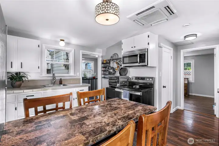 Kitchen view, hallway into 2 nd bedroom and door is for bathroom.