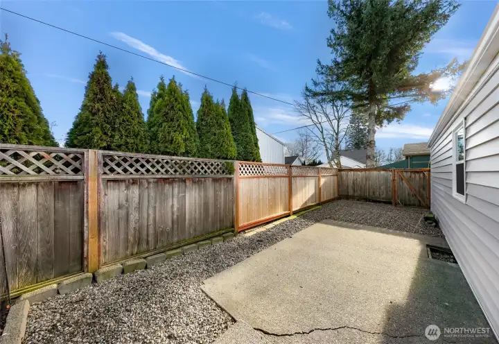 Fenced parking area and patio.
