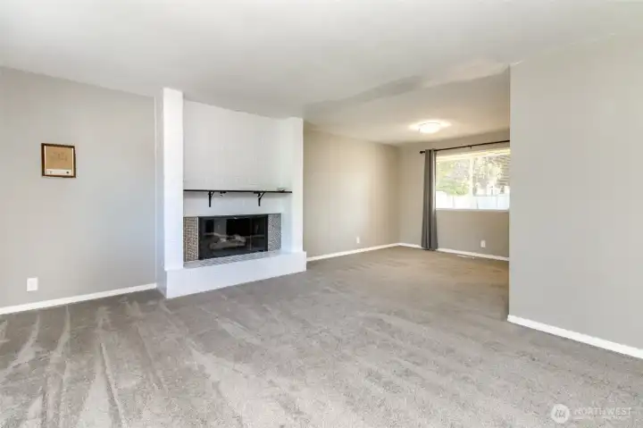 Vacant- oversized family room complete with updated gas fireplace. Vacant- oversized family room complete with updated gas fireplace.