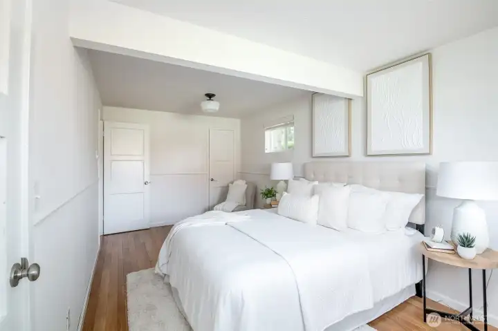 This primary bedroom has gorgeous new white oak floors.