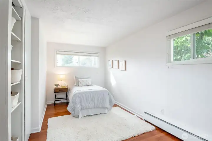 This second bedroom has unique built-in shelves.