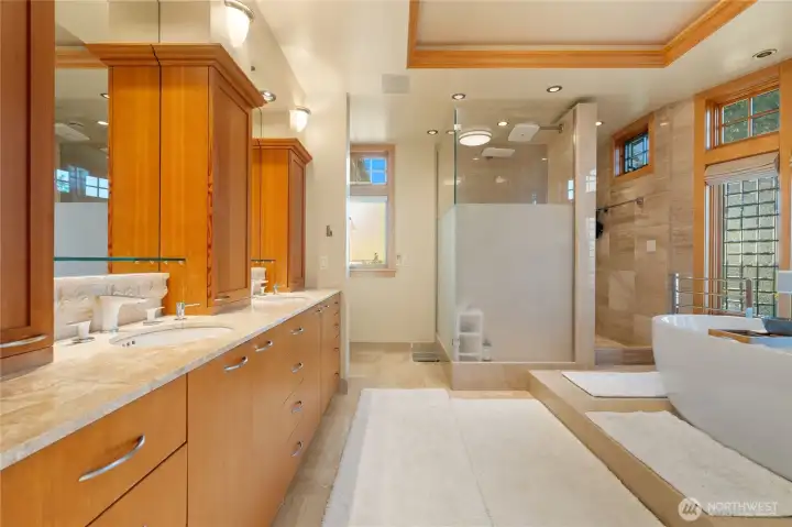 Brand new bathroom with deep soaking tub, double sinks, privacy shower and private toilet.. Hotel like spa grade experience for the primary occupants of this custom home.