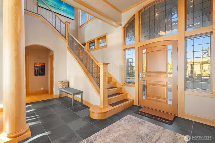 Upon entry a soaring staircase will take you upstairs and the vast view.