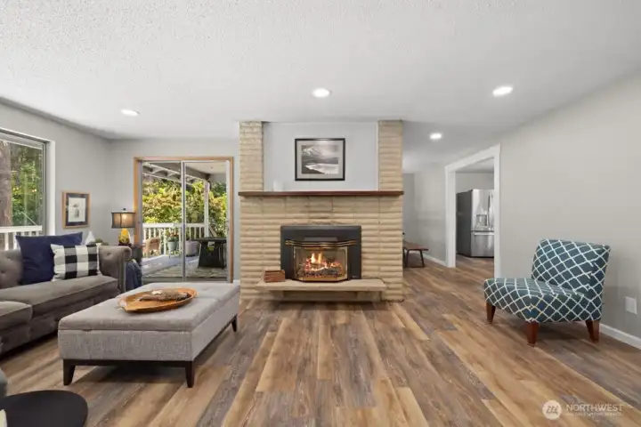 Large living room with fireplace and tons of natural light Large living room with fireplace and tons of natural light