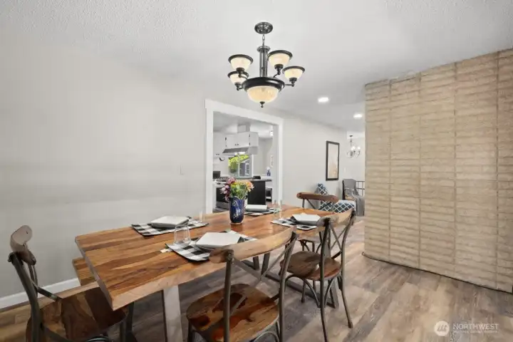 Dining room with accent wall. Living room and fireplace on the backside Dining room with accent wall. Living room and fireplace on the backside