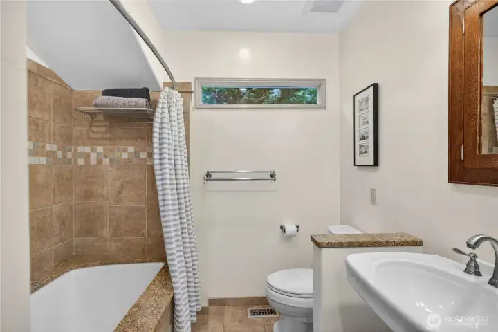 Main level full bathroom with heated floors