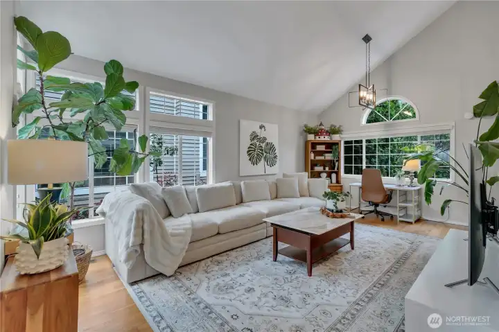 True hardwoods throughout main level! Desk looks out to backyard. Windows galore, cathedral ceiling & flexible spaces!