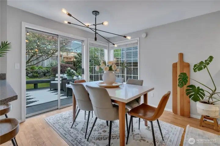 Dining room easily serves 6 with flexibility to enlarge when needed.  Slider out onto the deck & gardens!
