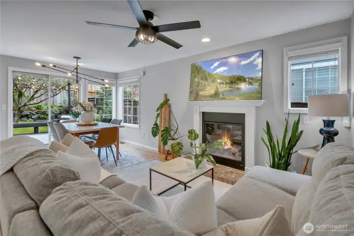 Family Room with modern fireplace & detailed hearth.  Note window next to fireplace, for extra light + a nod to bit of Craftsman style.