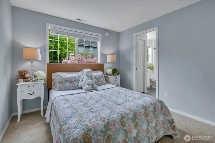 One of two side bedrooms.  Flowering dogwood in the garden.  Jack 'n Jill bath on right.