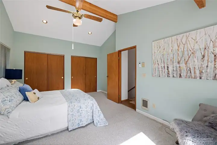Second bedroom upstairs with skylights and ample closet space