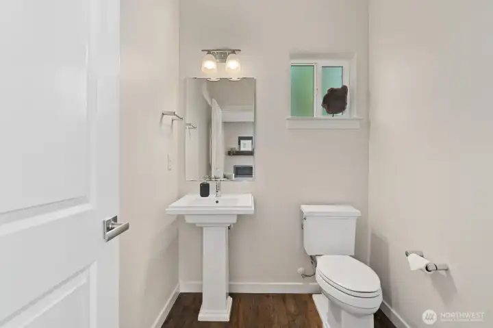 Convenient main-floor powder room for guests.