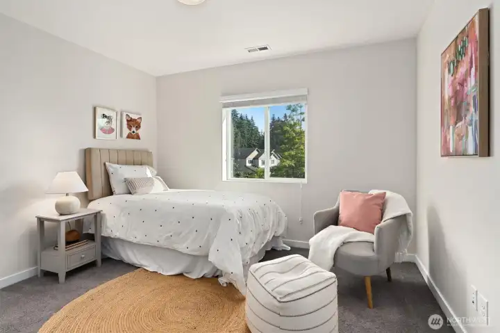 One of two well-sized secondary bedrooms on the upper level.