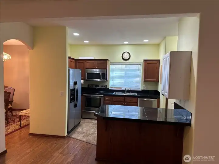 Kitchen has eating bar. Kitchen has eating bar.