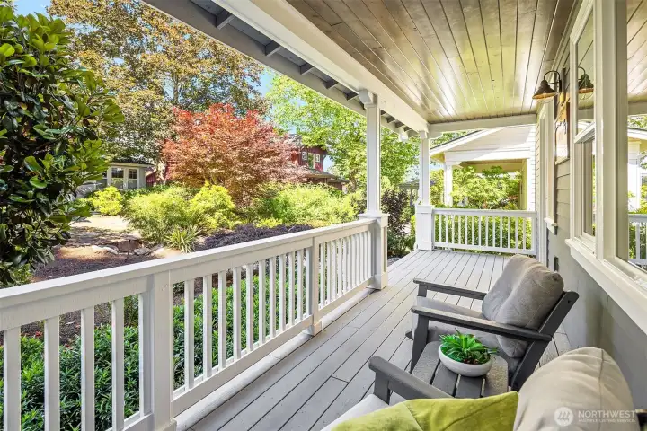 The quintessential rocking chair front porch overlooking beautiful landscaping which is maintained by the HOA.