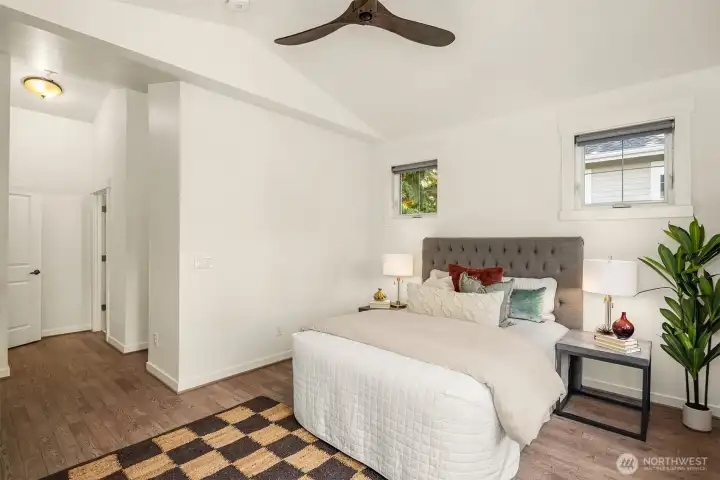 Looking towards the bedroom's entry, along with entry to the bathroom and walk-in closet.