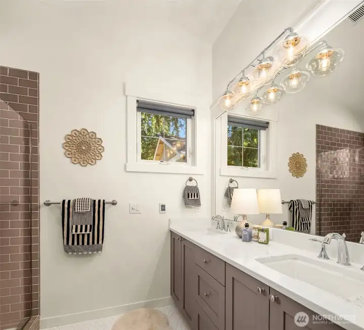 So stylish, also featuring abundant storage, separate water closet, and dual sinks.