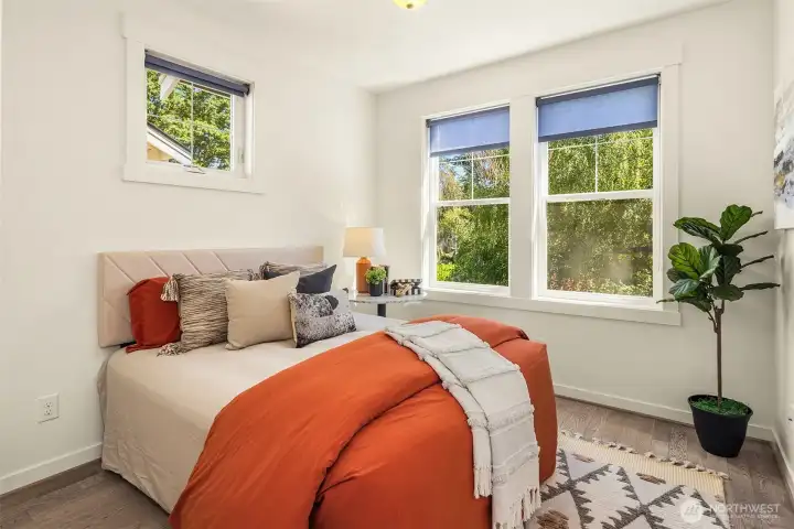 This secondary bedroom is also located on the upper level and has a walk-in closet and attached bath.