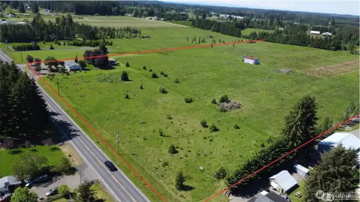 Property view from the front road coming from I-5 and heading into town of Winlock. Property lines are approximate