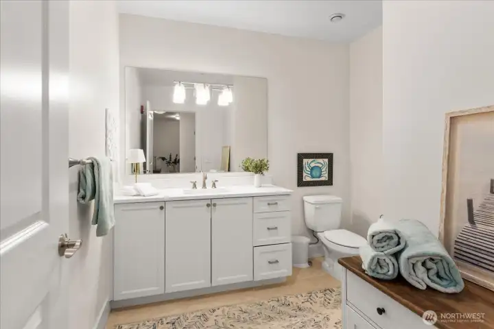 1/2 bath is generous for your guests and has newer quartz counter 1/2 bath is generous for your guests and has newer quartz counter