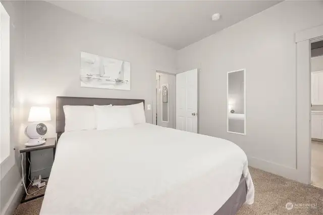 Second Bedroom off kitchen and Mudroom, leading into hallway to bathroom.