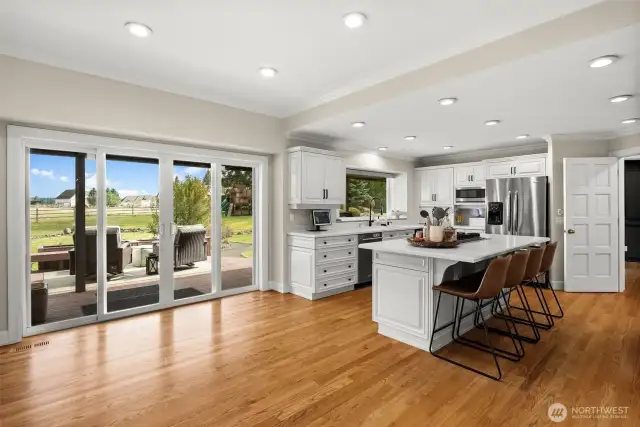 Double slider to another part of the expansive deck; Mt. Rainier views from this side of the home are breathtaking! All new windows and doors on this side as well.