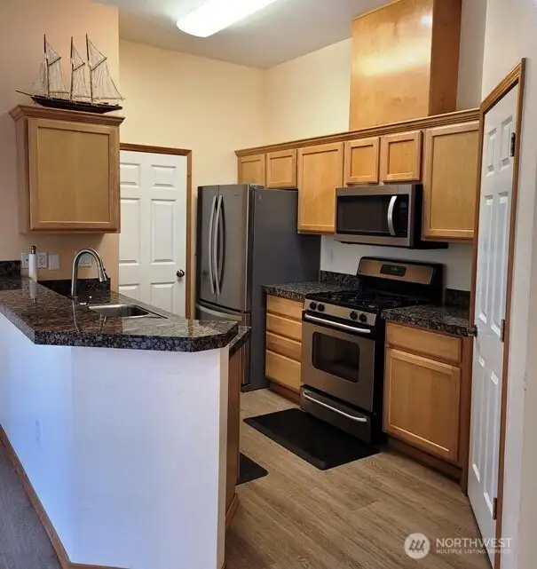 Beautiful Chef's kitchen with gas stove and pantry.