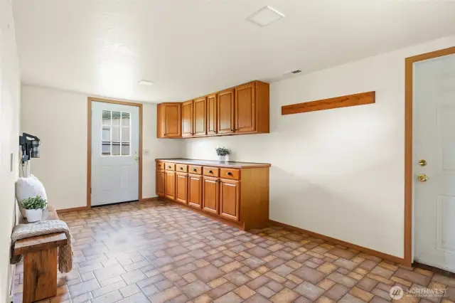 Huge bonus room, also used as office, doors to the back yard and garage.