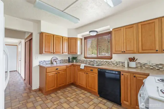 Kitchen into back entry and garage entrance. Coat closet too.