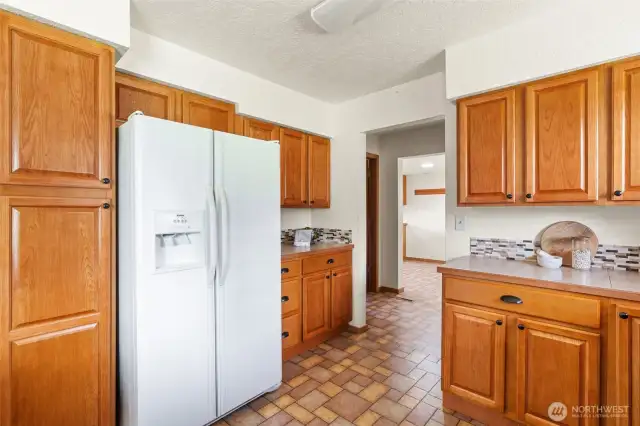 Kitchen into laundry with 1/2 bath on left