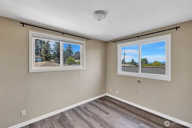 Upstairs Bedroom 2 with partial view to Puget Sound. Possible access to roof top Deck.
