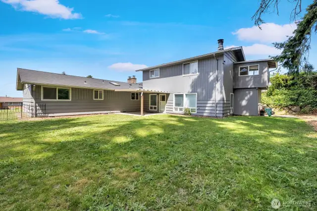 Large partially fenced in backyard great for entertaining