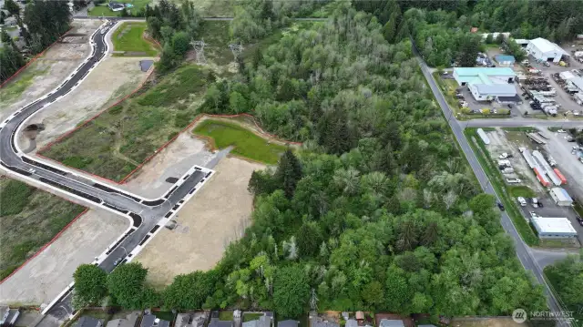 Westerly view of parcel with new build 'Trosper Woods' neighborhood South adjacent