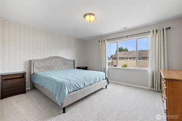 The generous primary boasts an oversized walk-in closet.